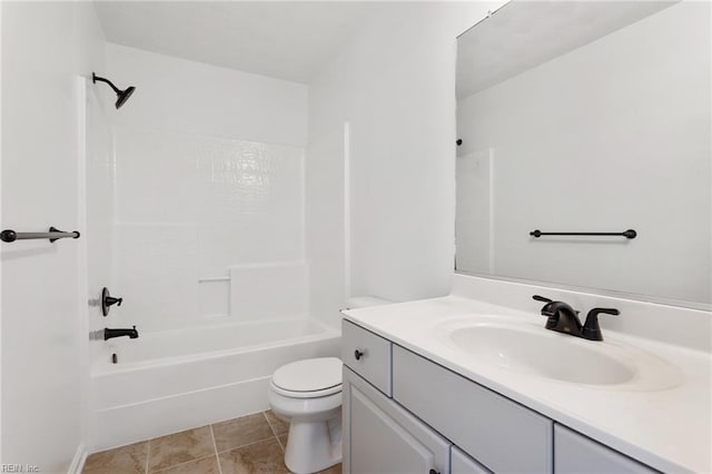 bathroom featuring toilet, vanity, and  shower combination