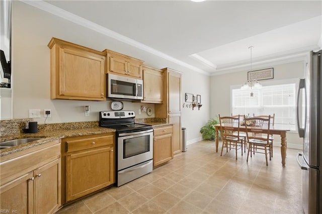 kitchen featuring appliances with stainless steel finishes, ornamental molding, baseboards, light stone counters, and a raised ceiling