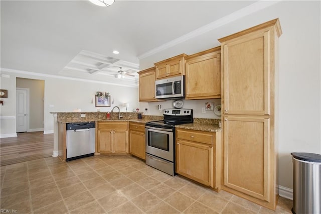 kitchen with appliances with stainless steel finishes, a peninsula, crown molding, coffered ceiling, and recessed lighting