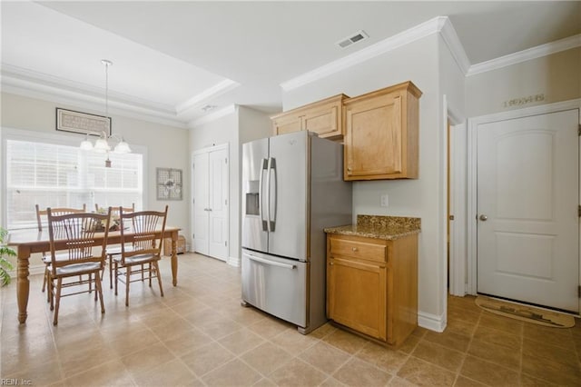 kitchen with stainless steel refrigerator with ice dispenser, crown molding, light stone countertops, a raised ceiling, and pendant lighting
