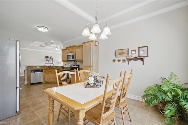 dining space featuring crown molding, light tile patterned floors, baseboards, and a chandelier