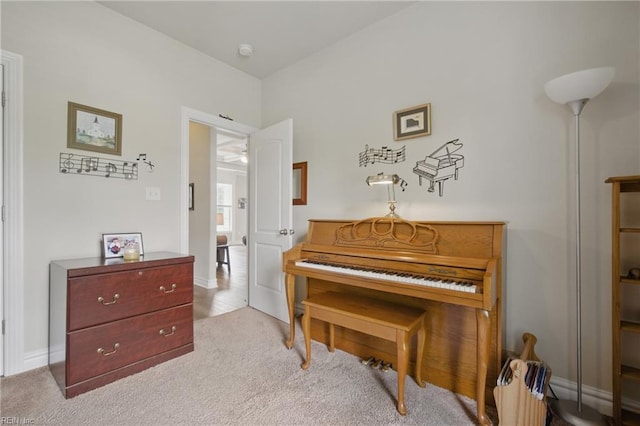 sitting room with carpet floors and baseboards