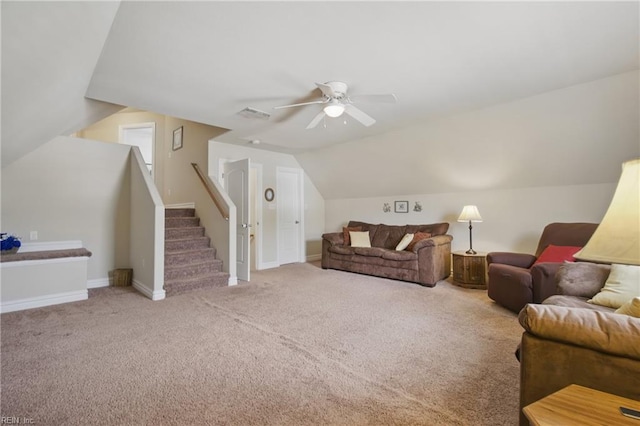living room with a ceiling fan, carpet flooring, lofted ceiling, baseboards, and stairway