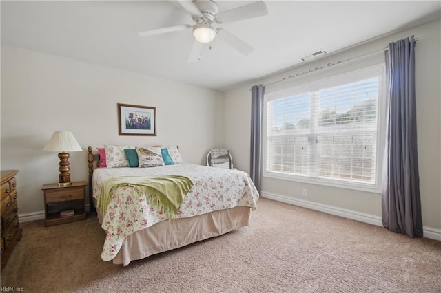 bedroom featuring carpet, baseboards, and a ceiling fan