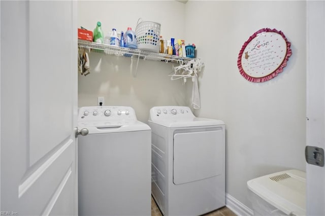 laundry room with washing machine and dryer