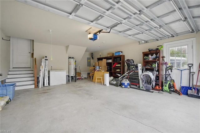 garage featuring a garage door opener, water heater, and electric panel