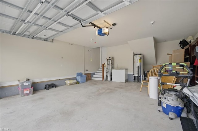 garage featuring water heater and a garage door opener