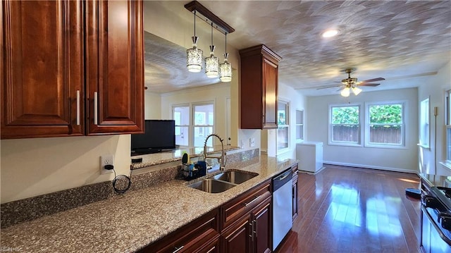 kitchen with a sink, stainless steel dishwasher, healthy amount of natural light, range with gas stovetop, and recessed lighting