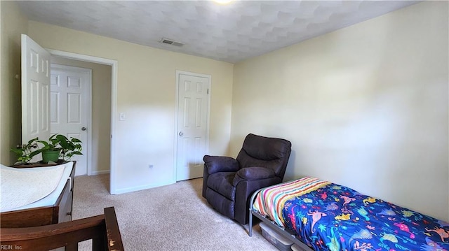 bedroom featuring carpet floors and baseboards