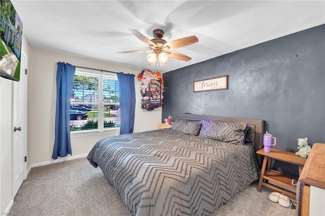 bedroom with carpet flooring, ceiling fan, and baseboards