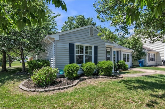 view of property exterior with a lawn