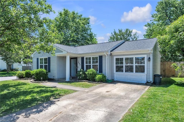 ranch-style home featuring roof with shingles and concrete driveway