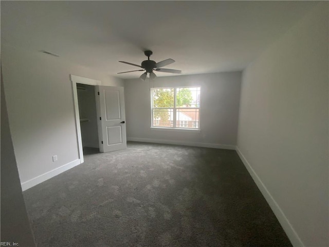 unfurnished bedroom with carpet flooring, baseboards, and ceiling fan