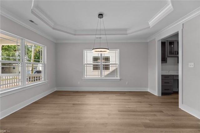 439 Cooper St, Hampton, VA 23669 - unfurnished dining area featuring a raised ceiling, light wood finished floors, ornamental molding, and baseboards