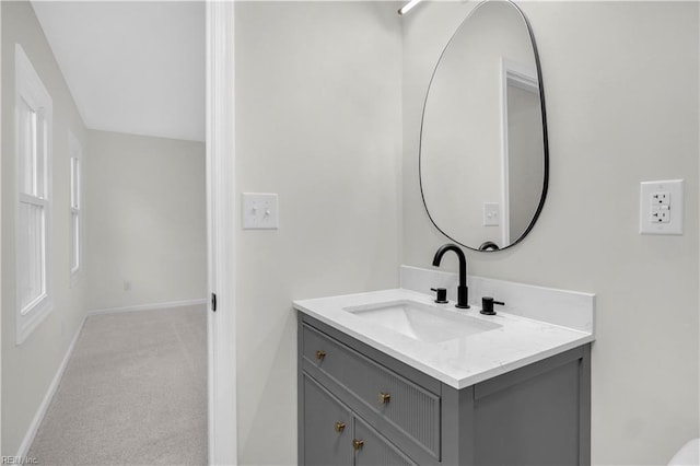 bathroom featuring vanity and baseboards