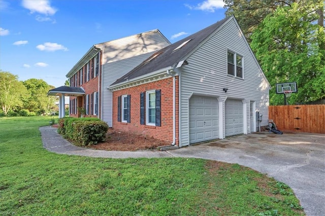 view of home's exterior featuring asphalt driveway, brick siding, and a garage
