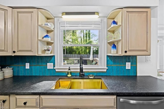 kitchen with open shelves, dishwasher, a sink, dark countertops, and decorative backsplash