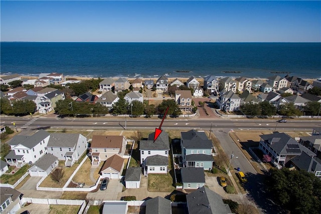 aerial overview of property's location with nearby suburban area and a nearby body of water