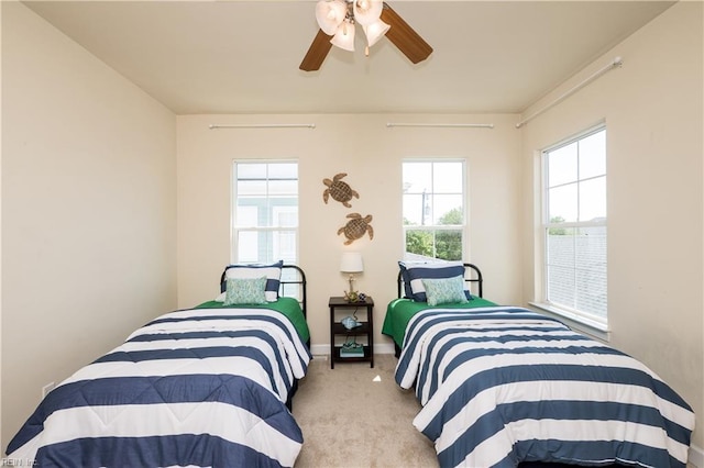 bedroom featuring carpet flooring, a ceiling fan, and baseboards