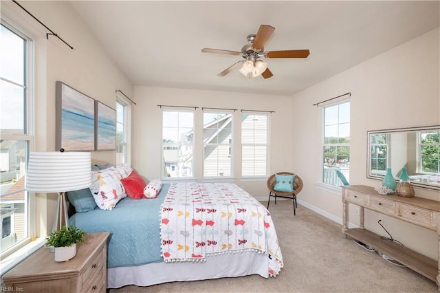 bedroom with carpet flooring, baseboards, and ceiling fan