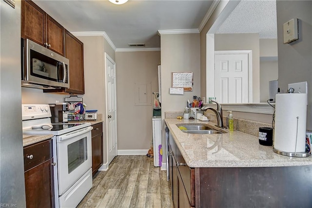 5120 Bardith Cir, Virginia Beach, VA 23455 - kitchen featuring white electric range oven, stainless steel microwave, a sink, light wood finished floors, and light stone countertops