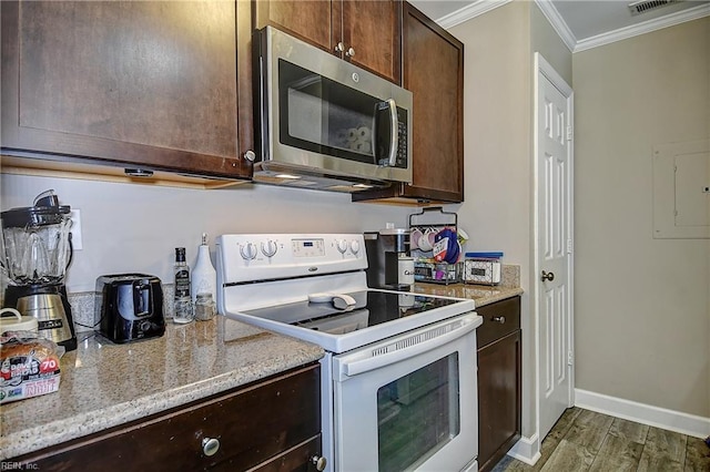 5120 Bardith Cir, Virginia Beach, VA 23455 - kitchen featuring white range with electric stovetop, stainless steel microwave, crown molding, dark brown cabinets, and wood finished floors