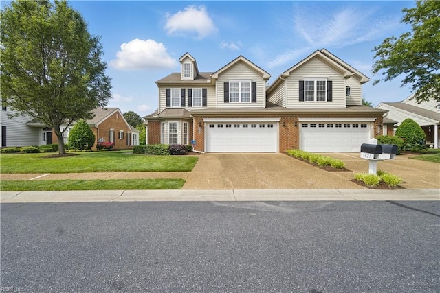 traditional-style house featuring concrete driveway, an attached garage, a front lawn, and brick siding