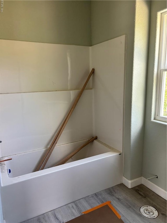 419B Elcinoca Dr, Elizabeth City, NC 27909 - full bath featuring wood finished floors, a bathtub, and baseboards