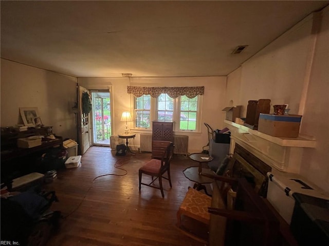 133 Dover Cir, Norfolk, VA 23505 - sitting room featuring radiator and wood finished floors