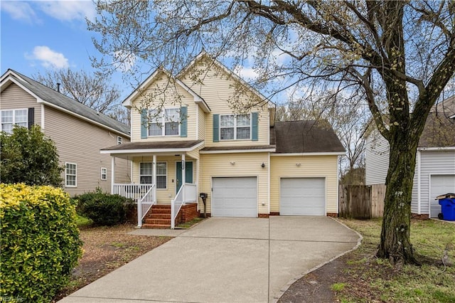 1309 W 25th St, Norfolk, VA 23508 - traditional-style house with covered porch, driveway, fence, and a garage