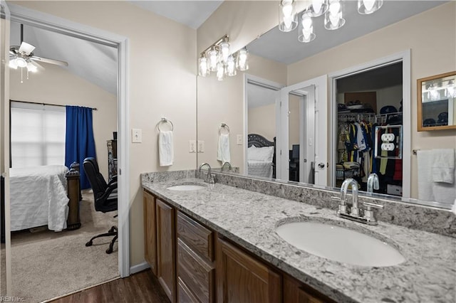 1309 W 25th St, Norfolk, VA 23508 - ensuite bathroom with wood finished floors, ceiling fan, double vanity, a walk in closet, and lofted ceiling