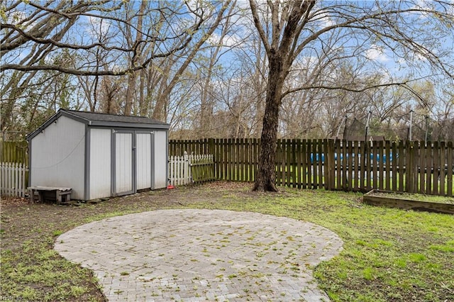 1309 W 25th St, Norfolk, VA 23508 - view of yard featuring an outdoor structure, a storage unit, and a patio