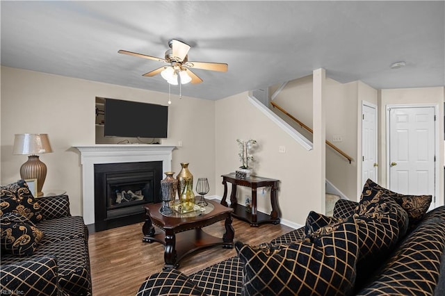 1309 W 25th St, Norfolk, VA 23508 - living room with wood finished floors, stairway, a ceiling fan, and a glass covered fireplace