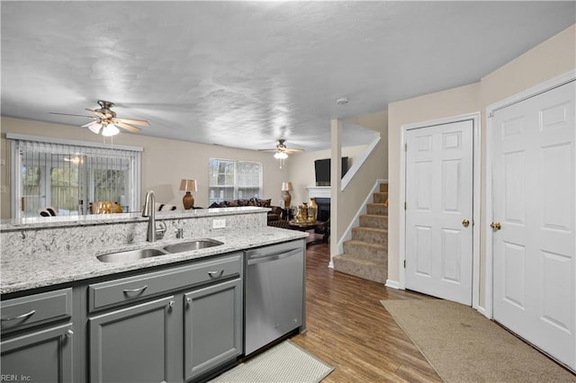 1309 W 25th St, Norfolk, VA 23508 - kitchen with stainless steel dishwasher, a sink, gray cabinets, and ceiling fan