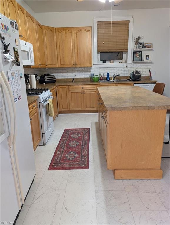kitchen with white appliances, light marble finish floors, a sink, and tasteful backsplash