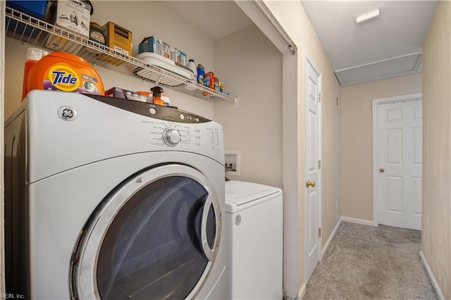 laundry room featuring carpet flooring, washer and dryer, and baseboards