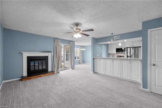 3513 Brigita Ct, Virginia Beach, VA 23453 - unfurnished living room with light carpet, baseboards, ceiling fan, a glass covered fireplace, and a textured ceiling