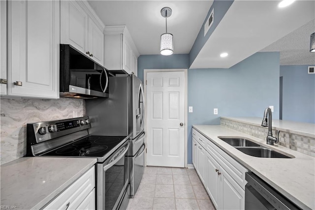 3513 Brigita Ct, Virginia Beach, VA 23453 - kitchen with stainless steel appliances, a sink, white cabinets, decorative backsplash, and recessed lighting