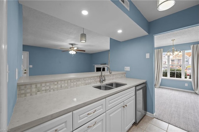 3513 Brigita Ct, Virginia Beach, VA 23453 - kitchen with a sink, stainless steel dishwasher, light carpet, a textured ceiling, and white cabinets