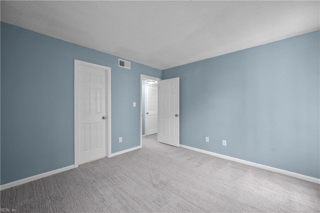3513 Brigita Ct, Virginia Beach, VA 23453 - unfurnished bedroom featuring a textured ceiling, carpet, and baseboards