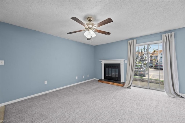 3513 Brigita Ct, Virginia Beach, VA 23453 - unfurnished living room with a ceiling fan, a textured ceiling, a glass covered fireplace, carpet, and baseboards