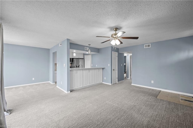 3513 Brigita Ct, Virginia Beach, VA 23453 - unfurnished living room featuring light carpet, a ceiling fan, baseboards, and a textured ceiling