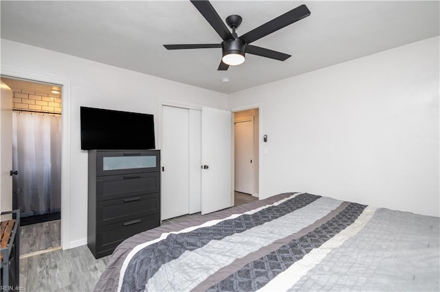bedroom featuring wood finished floors and ceiling fan
