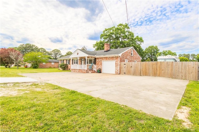 view of front of home featuring covered porch, a chimney, concrete driveway, an attached garage, and brick siding
