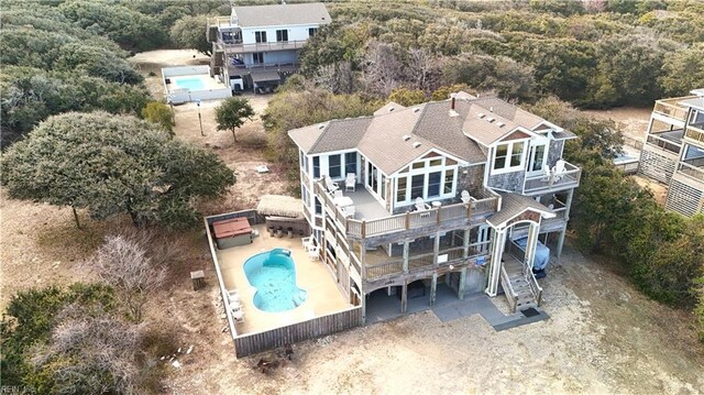 2390 Sandfiddler Rd, Corolla, NC 27927 - aerial view of property and surrounding area featuring a pool and a forest