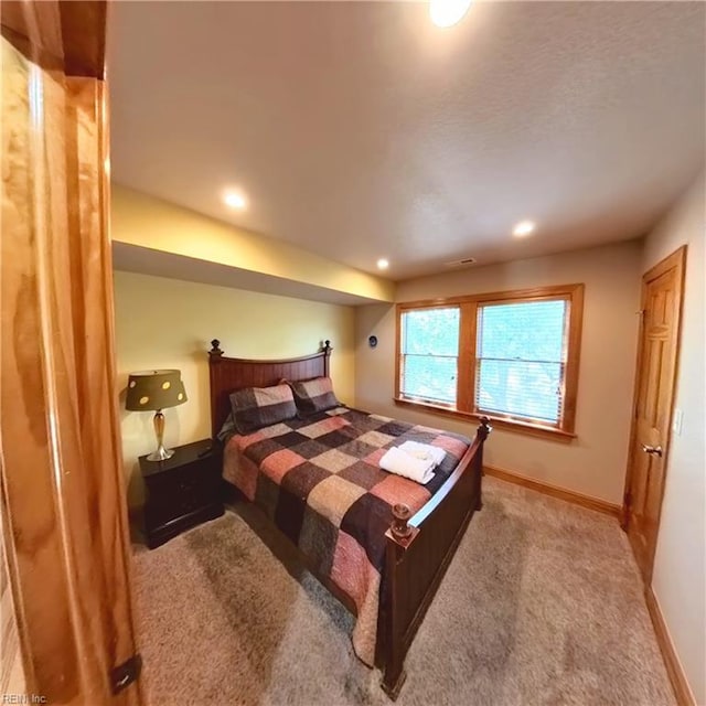 2390 Sandfiddler Rd, Corolla, NC 27927 - carpeted bedroom featuring baseboards and recessed lighting