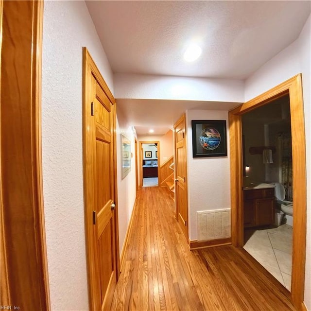 2390 Sandfiddler Rd, Corolla, NC 27927 - hallway with light wood-style flooring