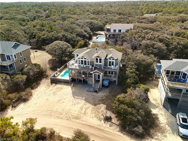 2390 Sandfiddler Rd, Corolla, NC 27927 - aerial view of property and surrounding area with a forest and a pool area
