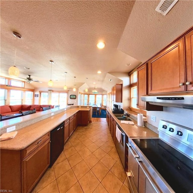 2390 Sandfiddler Rd, Corolla, NC 27927 - kitchen with appliances with stainless steel finishes, range hood, open floor plan, a textured ceiling, and brown cabinets