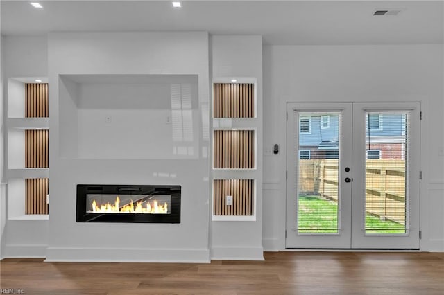 1 Lacrosse St, Hampton, VA 23663 - doorway with french doors, wood finished floors, a glass covered fireplace, and recessed lighting